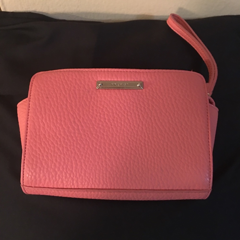 Salmon colored 9 west wristlet
